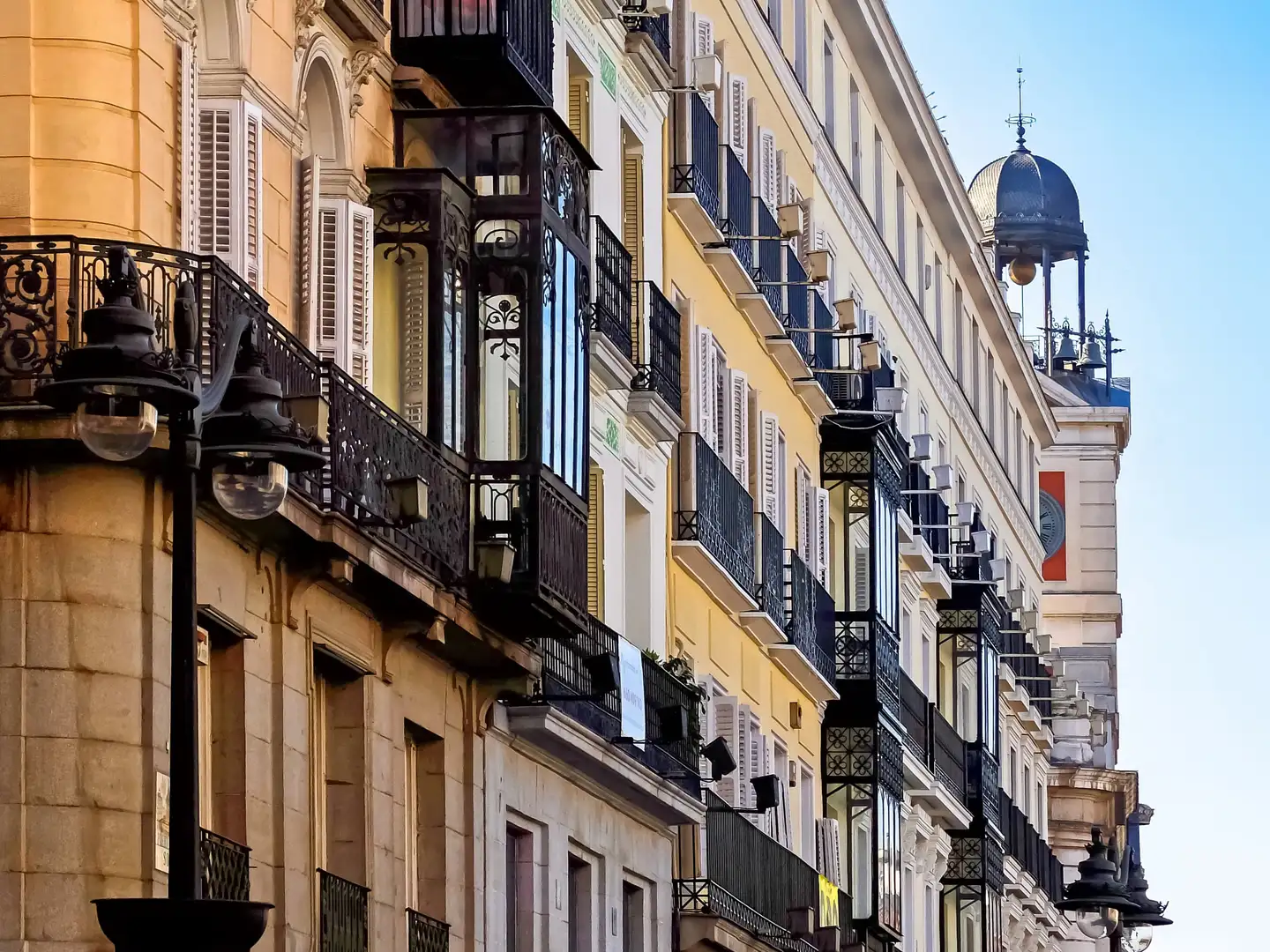 Warm stone facade of a traditional Madrid building